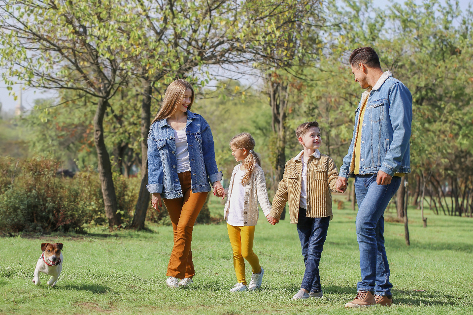 Couple walking together with their family