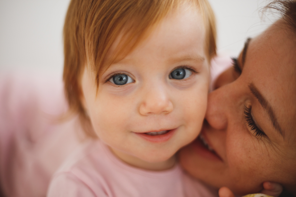 Parent comforting a child through a hard family transition