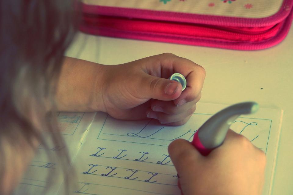 Child completing a chore independently