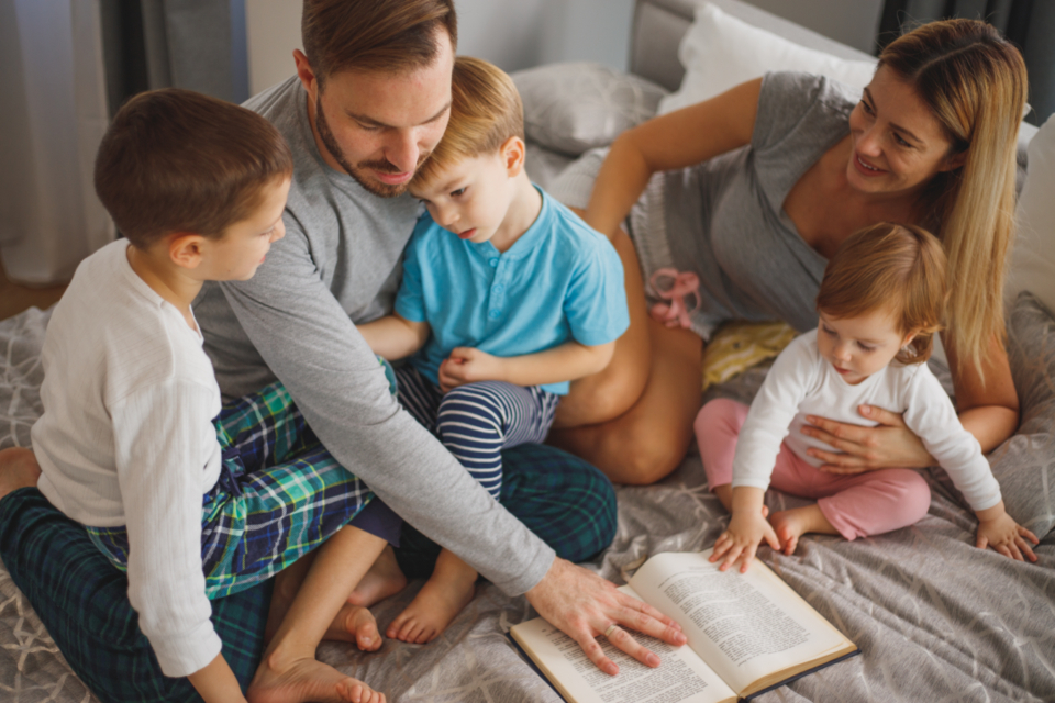 Family reading together at home