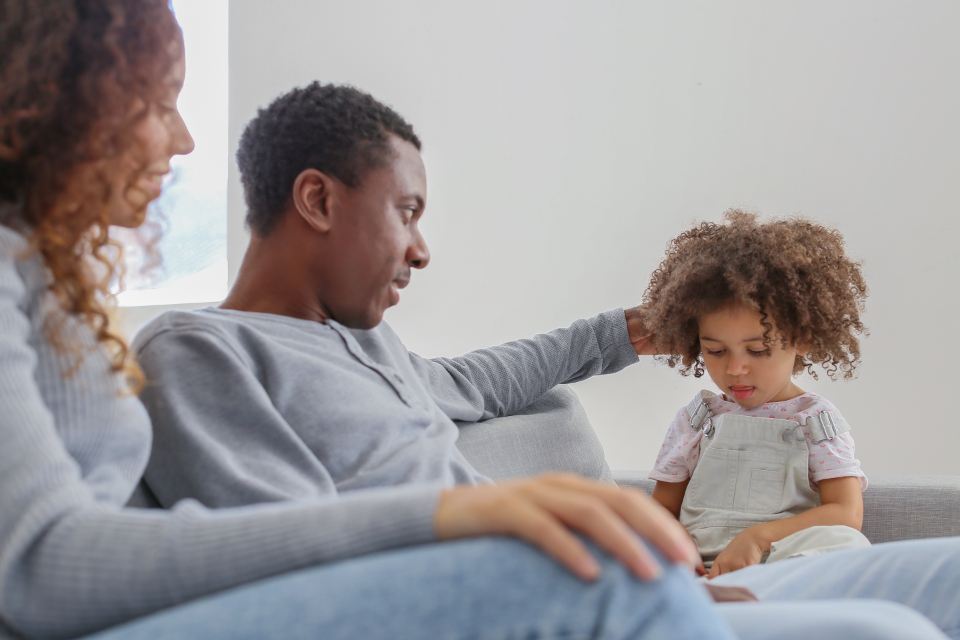 Family holding both pride and quiet grief together